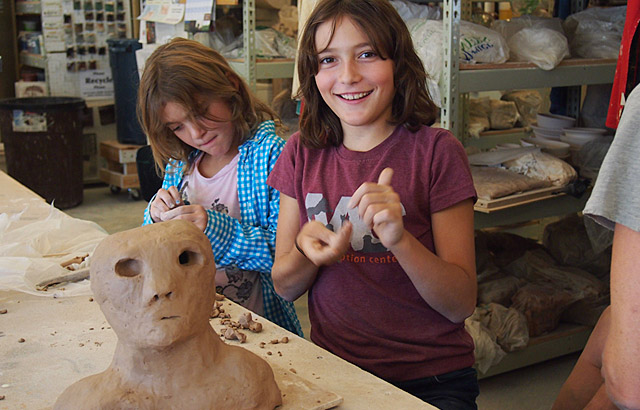 children making art with clay