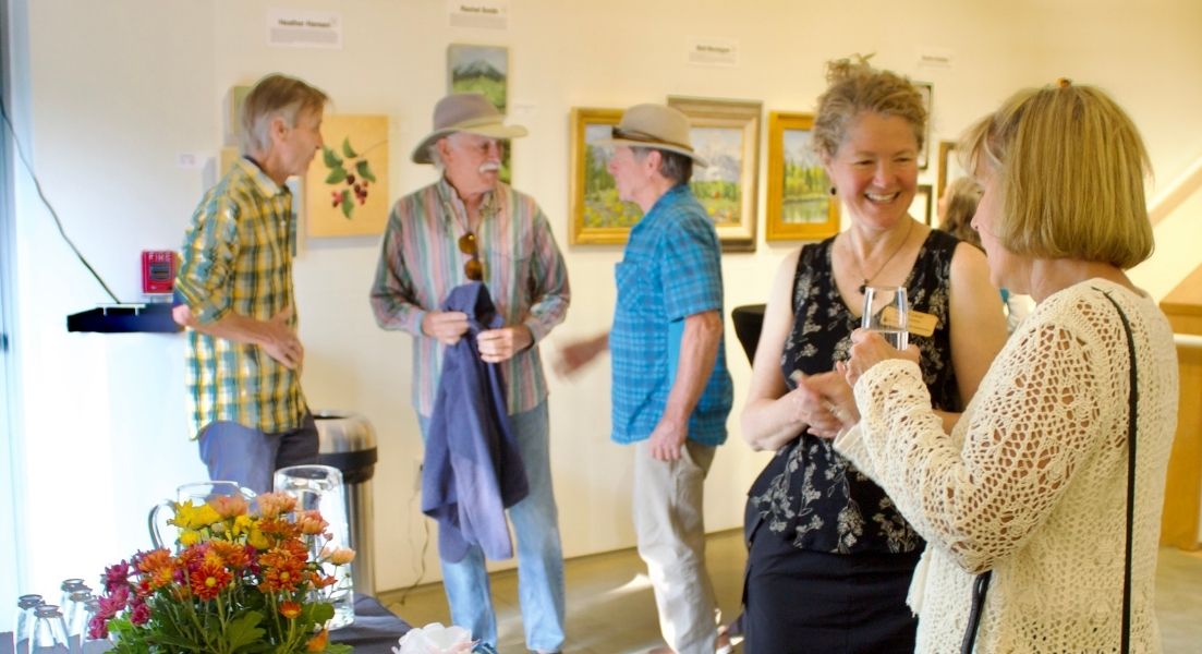 people socializing at an art gallery