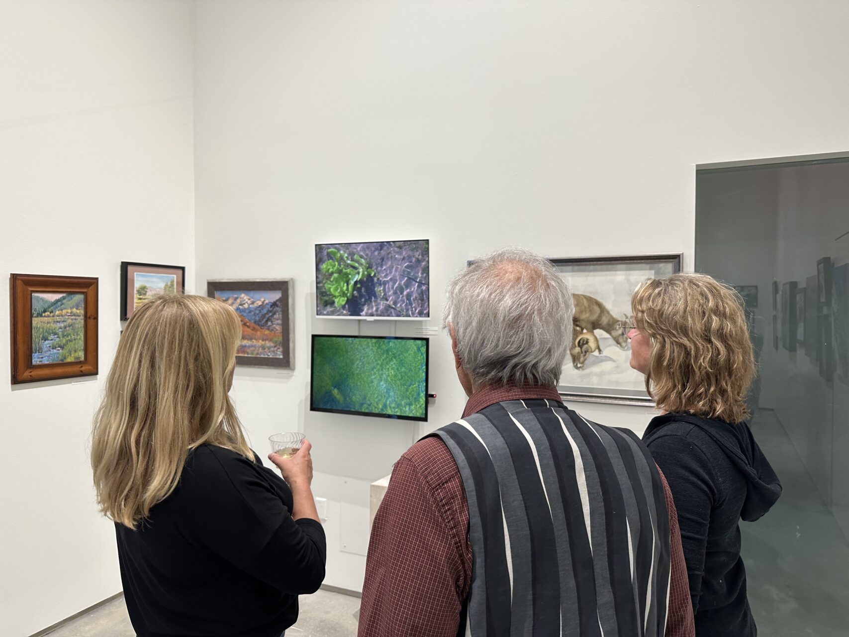 group of people looking at art