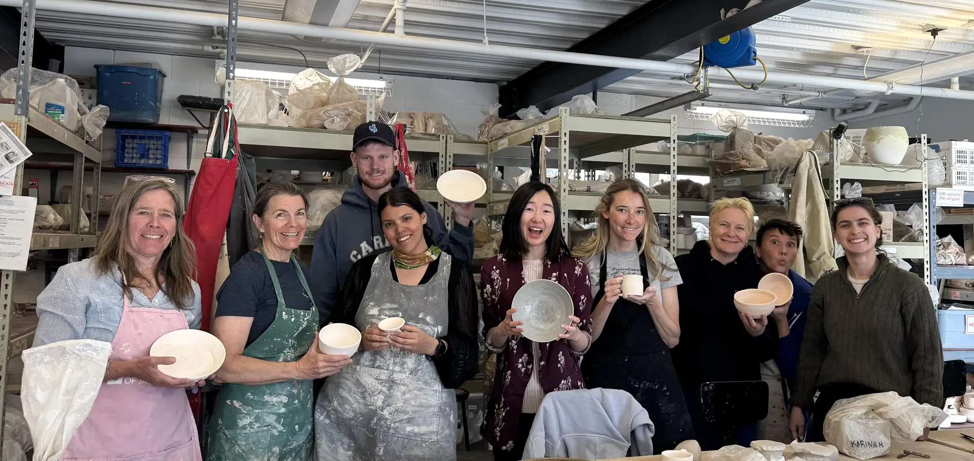 group of people in ceramics class
