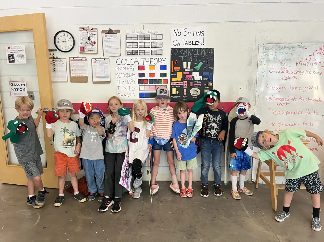 kids showing their art in art class